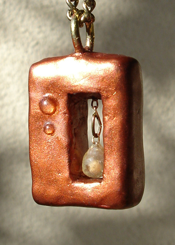 rectangular mustard seed pendant angle view